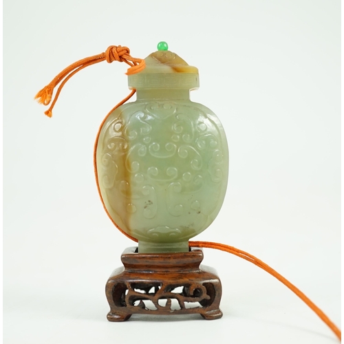 251 - A Chinese archaistic green and russet jade miniature vase and cover, fanghu, 19th century, carved in... 