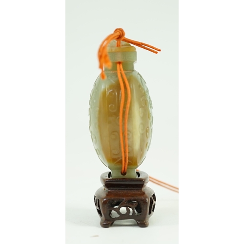 251 - A Chinese archaistic green and russet jade miniature vase and cover, fanghu, 19th century, carved in... 