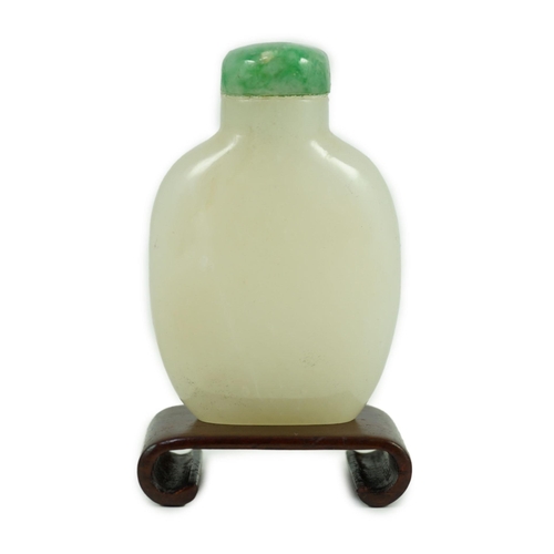 252 - A Chinese white jade snuff bottle, 19th/20th century, of flattened high shouldered form, on an oblon... 