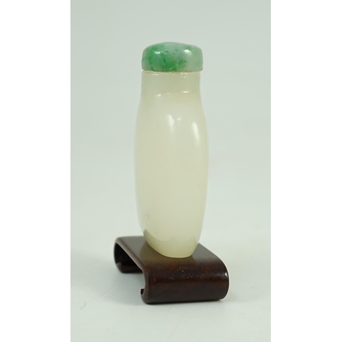 252 - A Chinese white jade snuff bottle, 19th/20th century, of flattened high shouldered form, on an oblon... 