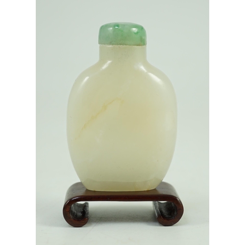 252 - A Chinese white jade snuff bottle, 19th/20th century, of flattened high shouldered form, on an oblon... 