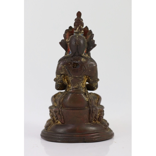 253 - A Tibetan gilt copper alloy figure of Amitayus, 16th/17th century, on a double lotus throne, formerl... 