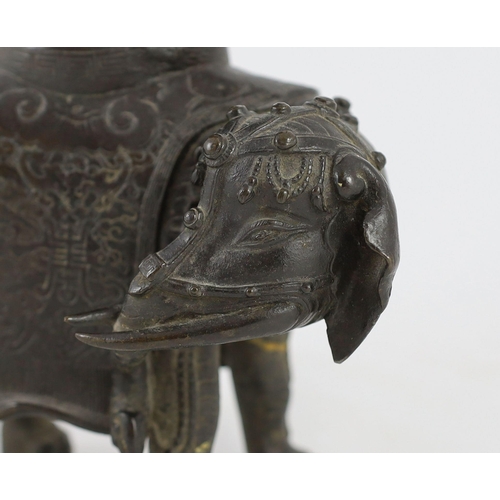 256 - A Chinese bronze elephant vessel, late Ming dynasty, modelled as a caparisoned elephant standing f... 