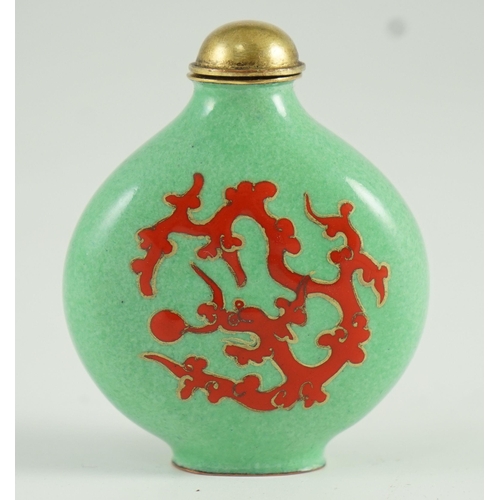 257 - A Chinese enamel on copper green ground snuff bottle, 19th/20th century, enamelled in red with a chi... 