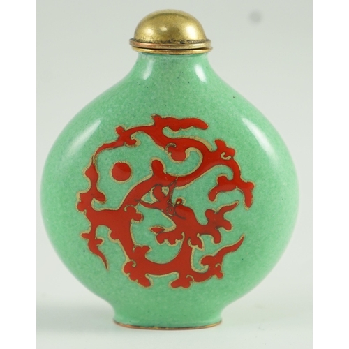 257 - A Chinese enamel on copper green ground snuff bottle, 19th/20th century, enamelled in red with a chi... 