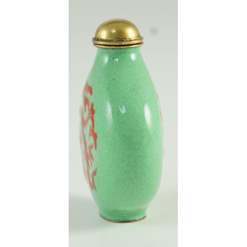 257 - A Chinese enamel on copper green ground snuff bottle, 19th/20th century, enamelled in red with a chi... 