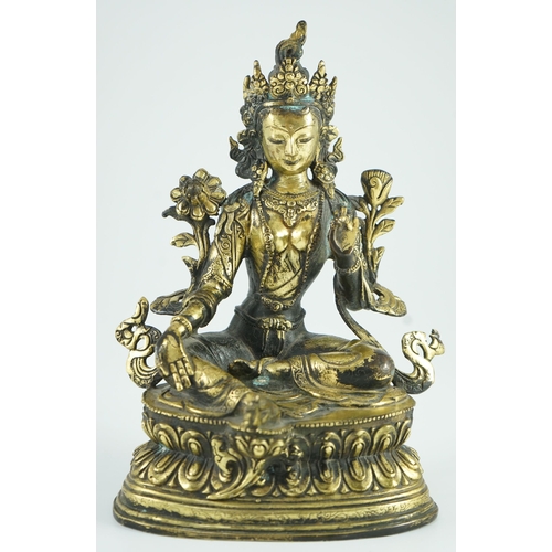 258 - A Sino-Tibetan bronze seated figure of Green Tara, 23.5 cm high