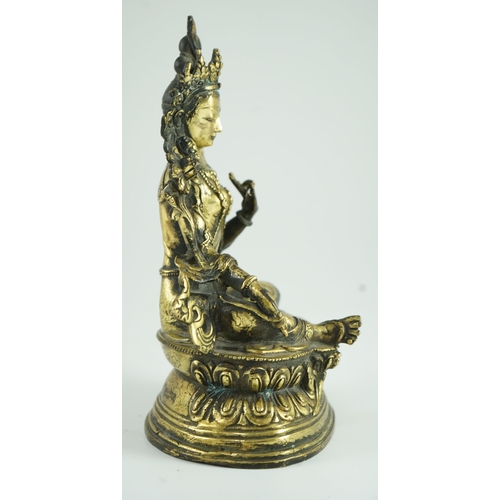 258 - A Sino-Tibetan bronze seated figure of Green Tara, 23.5 cm high