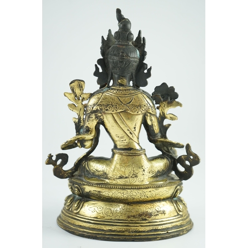 258 - A Sino-Tibetan bronze seated figure of Green Tara, 23.5 cm high