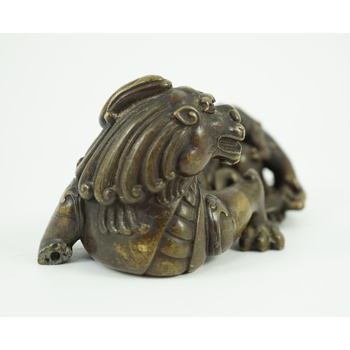 261 - A finely cast Chinese bronze lion-dog and cub scroll weight, 17th/18th century, 14cm long, one foot ... 