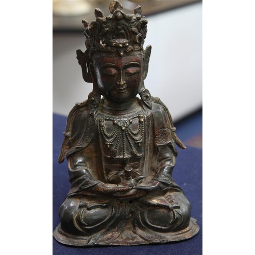 264 - A Chinese lacquered bronze seated figure of Guanyin, possibly Ming dynasty, 31cm high