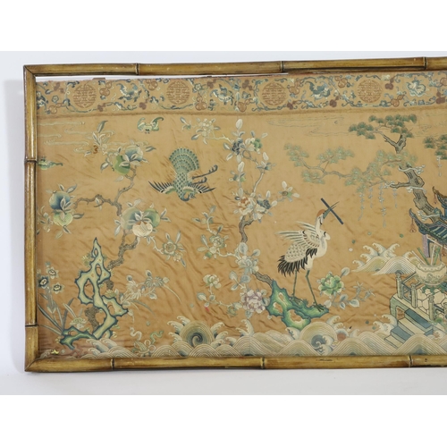 273 - A Chinese apricot ground embroidered silk table frontal, late Qing dynasty, finely worked with a cen... 