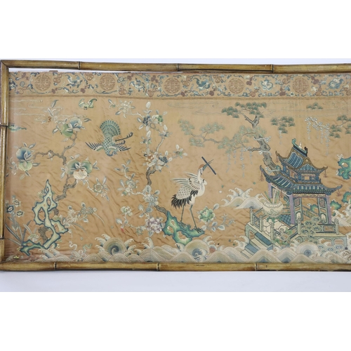 273 - A Chinese apricot ground embroidered silk table frontal, late Qing dynasty, finely worked with a cen... 