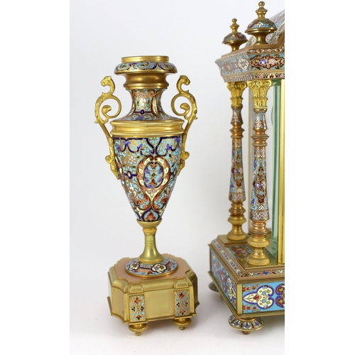 282 - An early 20th century French ormolu and champleve enamel clock garniture, the mantel clock of archit... 