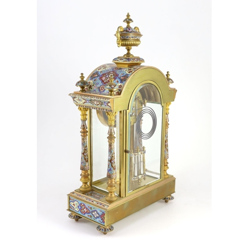 282 - An early 20th century French ormolu and champleve enamel clock garniture, the mantel clock of archit... 