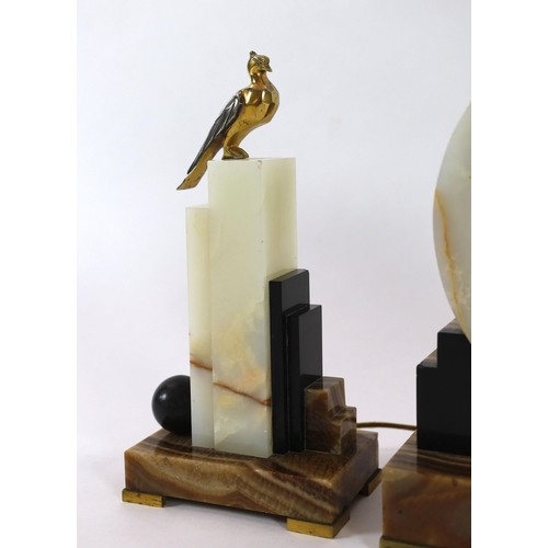 288 - F.H. Danvin. A 1930's French Art Deco bronze mounted onyx and marble clock garniture, the central ma... 