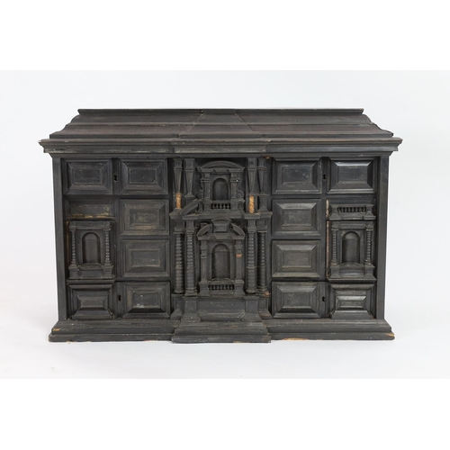 300 - An early 18th century Portuguese ebonised table cabinet, of architectural form, with central door en... 