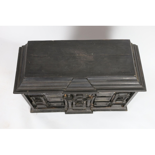 300 - An early 18th century Portuguese ebonised table cabinet, of architectural form, with central door en... 