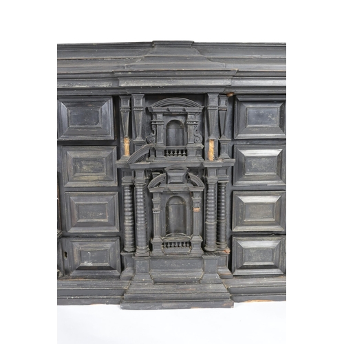 300 - An early 18th century Portuguese ebonised table cabinet, of architectural form, with central door en... 