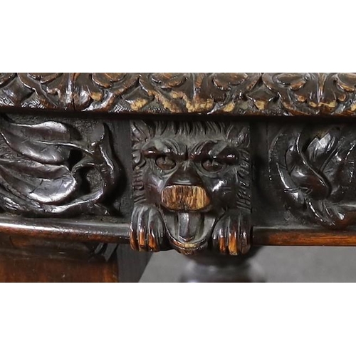 301 - A late Victorian carved oak extending dining table, with rounded D shaped ends and four leaves, the ... 