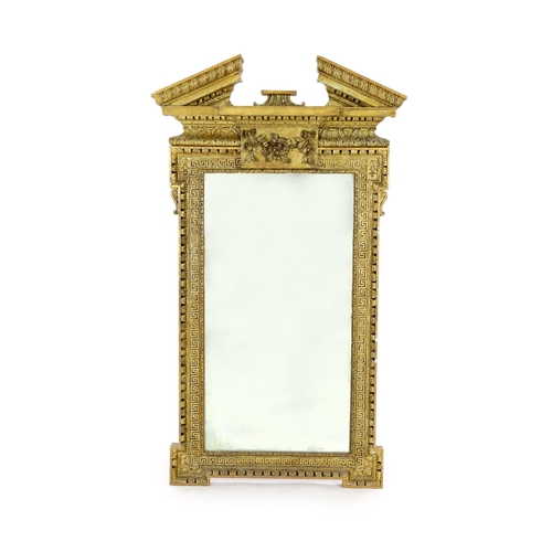 304 - A George II carved giltwood Adam design wall mirror, with broken arch pediment, raised flower and fr... 