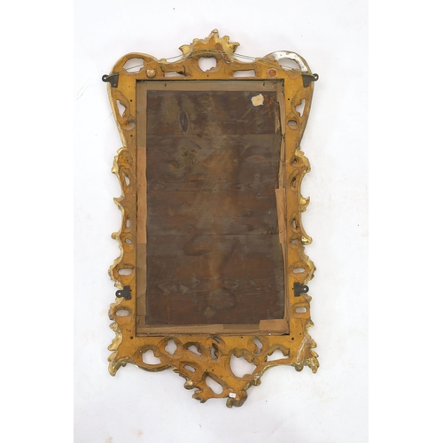 305 - A George III carved giltwood wall mirror, of serpentine rectangular form, with pierced foliage and s... 