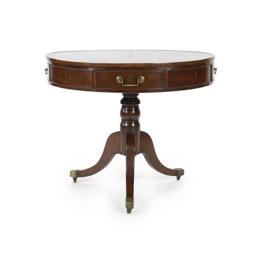 306 - A George III mahogany drum top table, with brown skiver and four frieze and four dummy drawers, on t... 