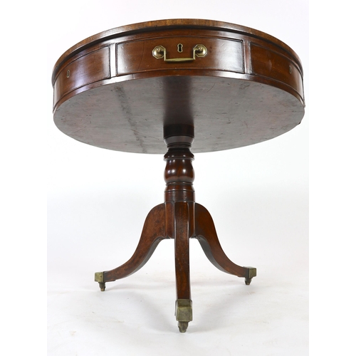 306 - A George III mahogany drum top table, with brown skiver and four frieze and four dummy drawers, on t... 