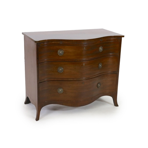 307 - A George III mahogany serpentine chest, with brushing slide and three graduated long drawers, on swe... 