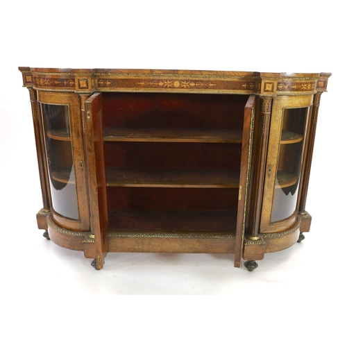 323 - A Victorian walnut and marquetry side cabinet, with central twin panelled doors and bowed glazed doo... 