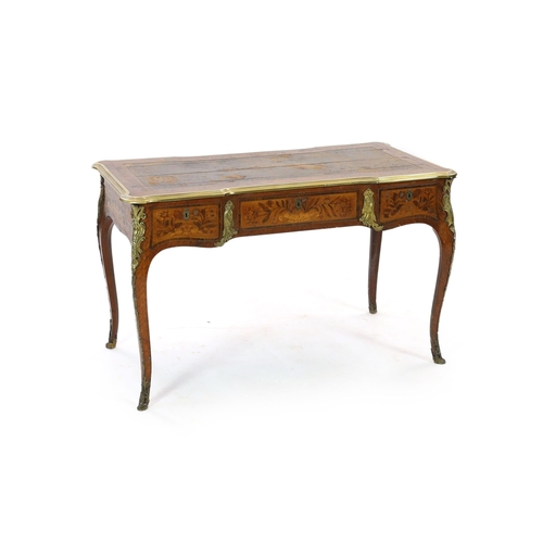 333 - An early 20th century Louis XVI style ormolu mounted marquetry bureau plat, with brown leather skive... 