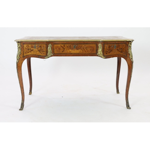 333 - An early 20th century Louis XVI style ormolu mounted marquetry bureau plat, with brown leather skive... 