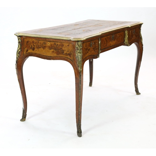 333 - An early 20th century Louis XVI style ormolu mounted marquetry bureau plat, with brown leather skive... 