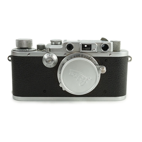 41 - A Leica IIIa camera, number 302196 with Leitz Elmar F51:35 lens, Elmar 5cm adapter ring and leather ... 