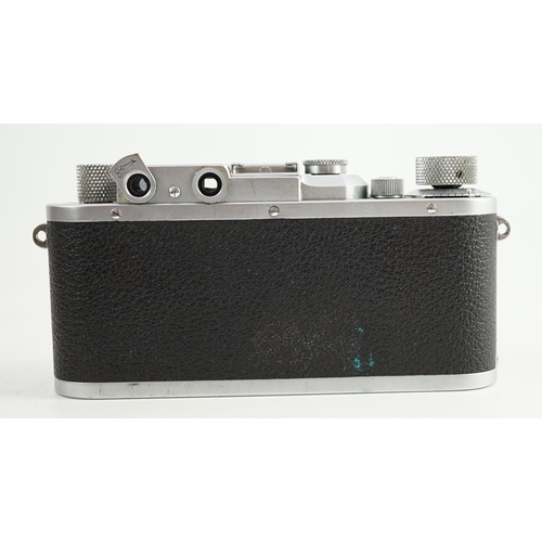 41 - A Leica IIIa camera, number 302196 with Leitz Elmar F51:35 lens, Elmar 5cm adapter ring and leather ... 