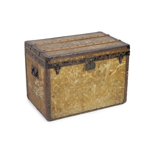 44 - An early 20th century Louis Vuitton iron bound travelling trunk, with yellow LV fabric covering and ... 