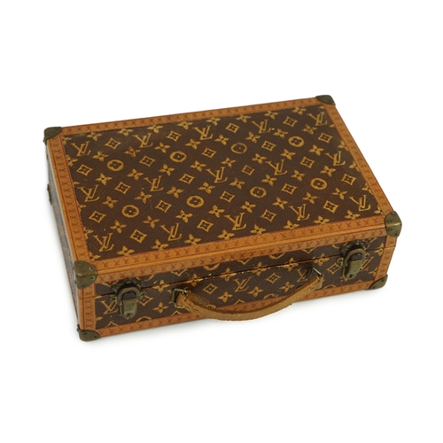 46 - A 1920s Louis Vuitton miniature suitcase, stamped L.Vuitton, 20 x 13 x 6cm.