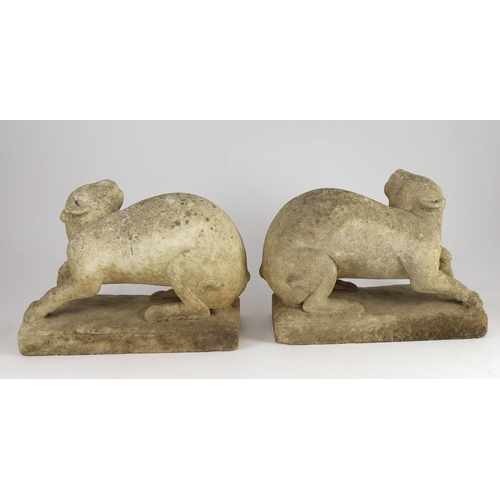 49 - A pair of 19th century carved marble models of crouching cats, width 32cm, depth 12cm, height 22cm... 