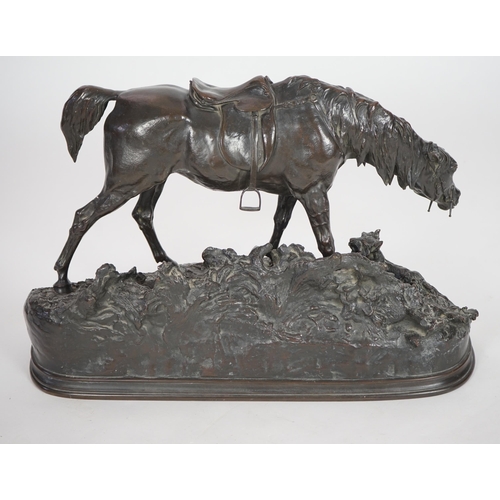 65 - Pierre Jules Mène (French, 1810-1879). A bronze group of a saddled horse standing upon a mound with ... 