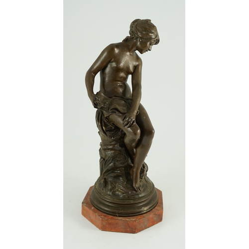 68 - Auguste Moreau (French, 1834-1917). A bronze figure of a nude girl seated on a mound holding a book ... 