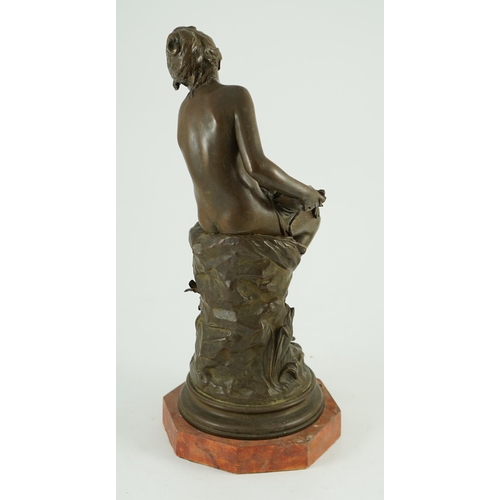 68 - Auguste Moreau (French, 1834-1917). A bronze figure of a nude girl seated on a mound holding a book ... 