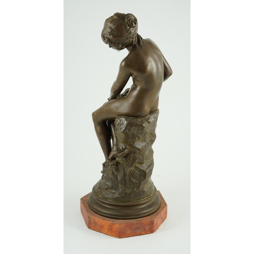 68 - Auguste Moreau (French, 1834-1917). A bronze figure of a nude girl seated on a mound holding a book ... 