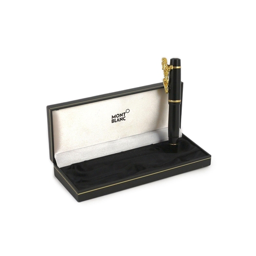 7 - A Mont Blanc Year of the Golden Dragon fountain pen, the cap applied with a dragon holding a pearl i... 