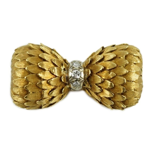 711 - A stylish 1960's textured 18ct gold and three stone diamond set bow brooch, 32mm, gross weight 9.7 g... 