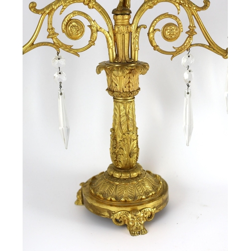 78 - A pair of 19th century Grecian revival ormolu two lights candelabra, with classical goddess finials,... 