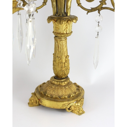 78 - A pair of 19th century Grecian revival ormolu two lights candelabra, with classical goddess finials,... 