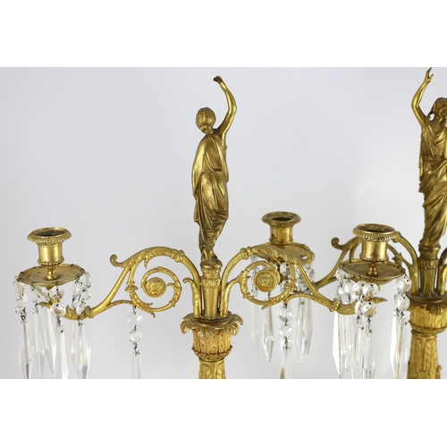 78 - A pair of 19th century Grecian revival ormolu two lights candelabra, with classical goddess finials,... 