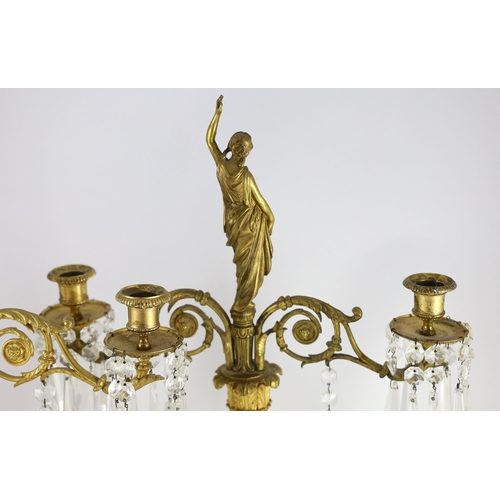 78 - A pair of 19th century Grecian revival ormolu two lights candelabra, with classical goddess finials,... 