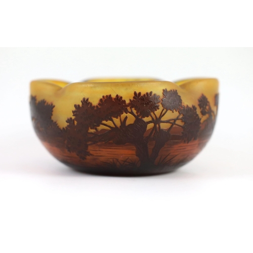 81 - A Daum cameo glass dusk river landscape bowl, c.1905, of quatrefoil form, decorated with trees and... 