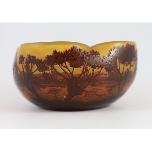 81 - A Daum cameo glass dusk river landscape bowl, c.1905, of quatrefoil form, decorated with trees and... 